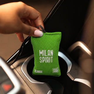 Milan Spirit scented car air freshener beanbag by The Scentz Company placed inside car interior delivering long lasting citrus herbal fragrance