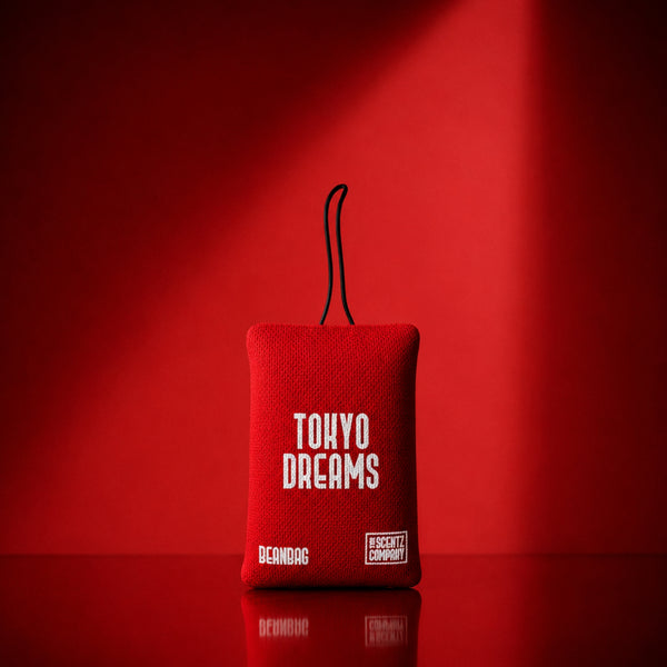 Tokyo Dreams scented car air freshener beanbag by The Scentz Company placed inside car interior delivering floral fruity long lasting fragrance