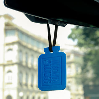 London Flair scented poly card car air freshener by The Scentz Company hanging inside car interior delivering fresh citrus inspired long lasting fragrance
